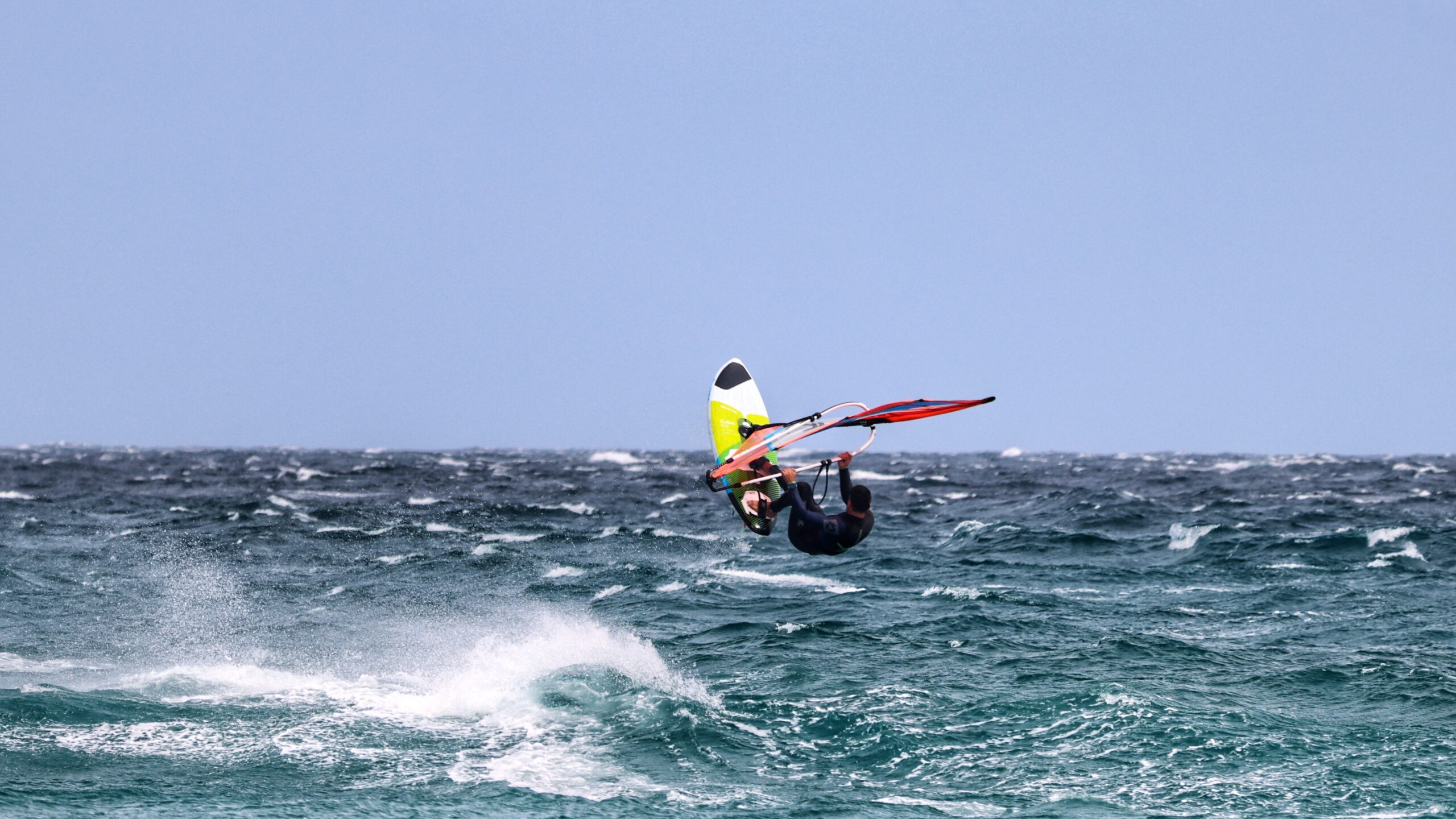 THe reality of windsurfing from a sailboat. 