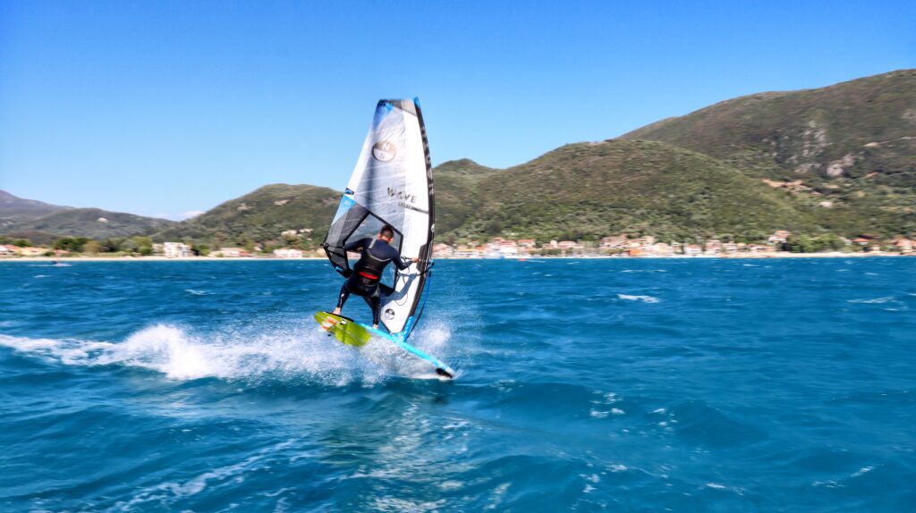 Windsufing off the back of a sailing boat in Vasiliki, Greece. 