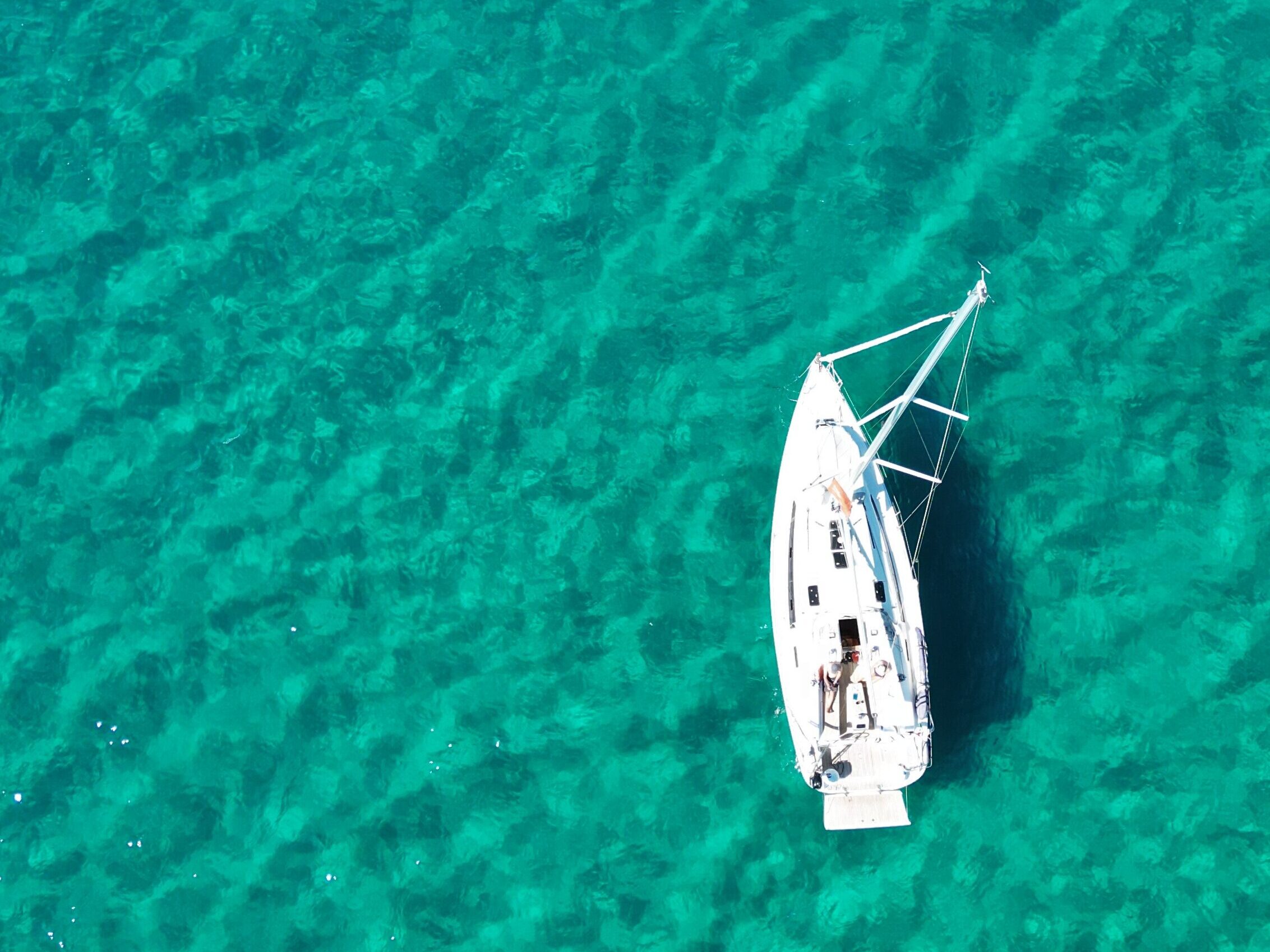Sailing yacht anchored in clear turquoise waters off Elba Island Tuscany