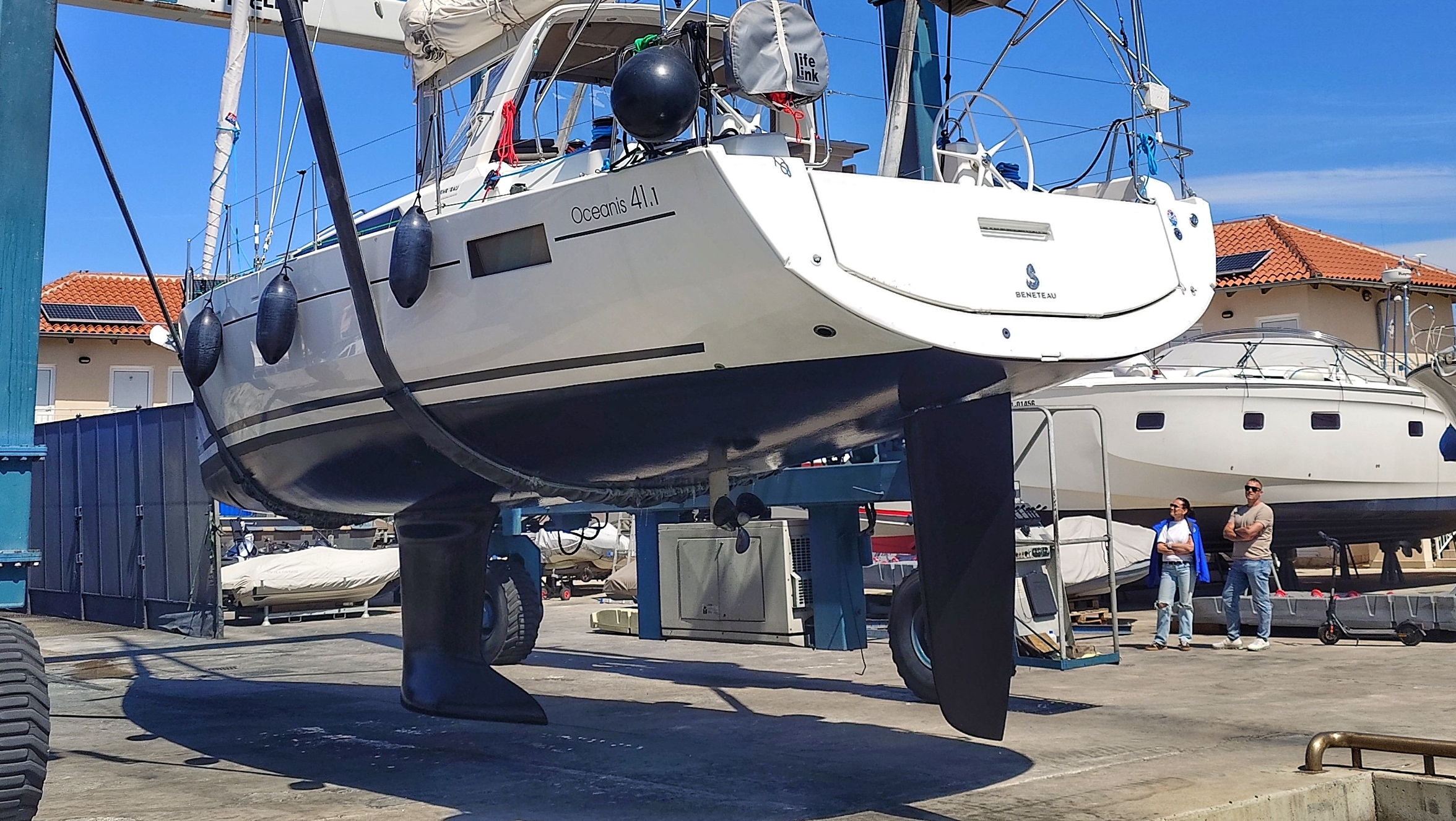 Modern cruising yacht in travelift showing single rudder and centerline propeller setup